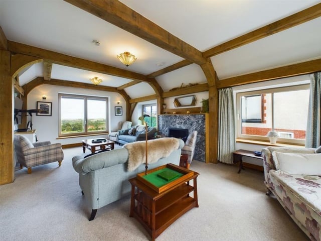 The first floor lounge has a striking feature fireplace, and a bespoke stained glass window.