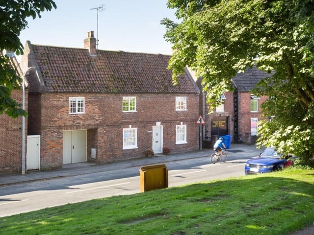 The front aspect of the former coach house property in Kilham.