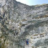 A Coastguard technician descending the 45-metre cliffs