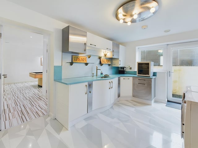 A prep kitchen forms part of the lower floor entertainment suite.