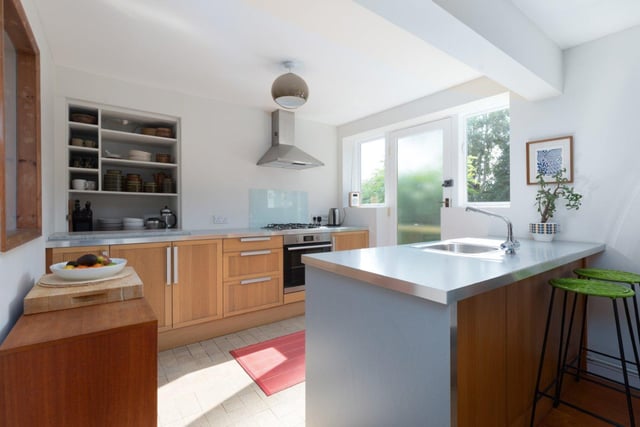 The open plan kitchen has a door to the rear garden.