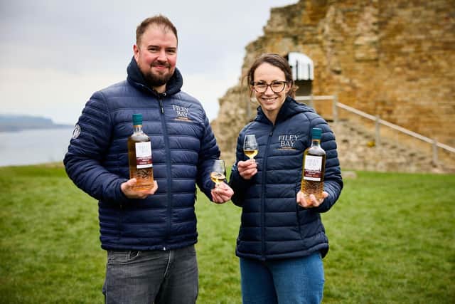 Spirit of Yorkshire whisky director Joe Clark and marketing director Jenni Ashwood with the new whisky at English Heritage site, Scarborough Castle