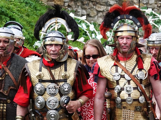Reverend Sam Treadwell is escorted to the opening of The Big Day Out at Scarborough Castle by the Roman VI Legion from York.