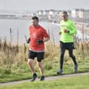 Brid Road Runners' Graham Lonsdale, green shirt, works his way through the field at Sewerby parkrun. PHOTO BY ALEXANDER FYNN