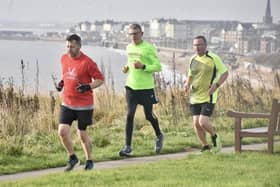 Brid Road Runners' Graham Lonsdale, green shirt, works his way through the field at Sewerby parkrun. PHOTO BY ALEXANDER FYNN