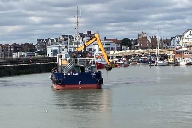 Ian Sandy captures the Gypsey Race dredger working in the harbour.