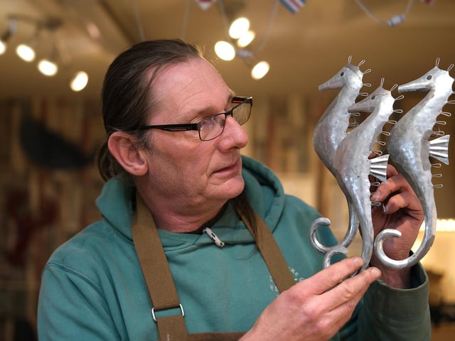 Mike Fullerton of White Beach Designs creates beautiful art and jewellry from sterling silver. His shop is located on the Mezzanine.