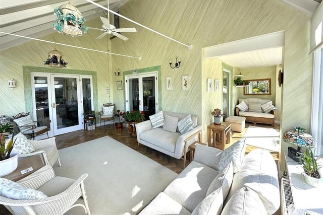 A spacious sun room adds flexible space to the home.