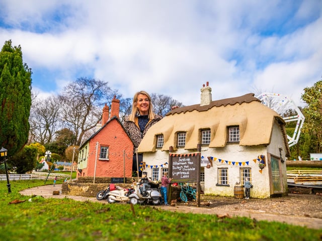 Rachel Hill, Owner of Bondville Model Village in Bridlington, inspecting and cleaning her model village.