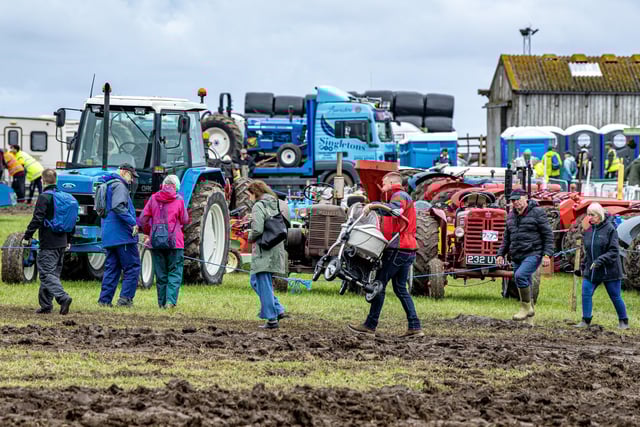 Visitors tackle the muddy conditions