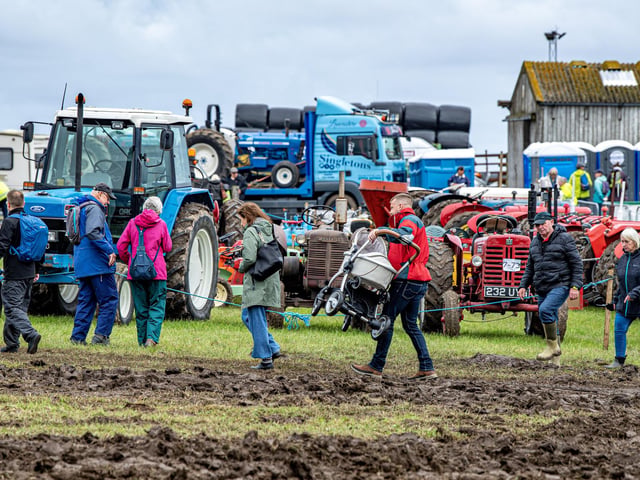 Visitors tackle the muddy conditions