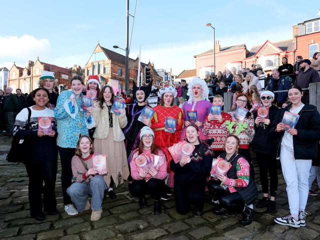 The YMCA Theatre group cheer for Santa