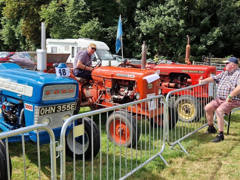 Thornton Le Dale show 2022; admiring the tractors.