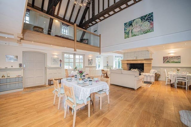 The property's stylish open-plan interior with vaulted ceiling.
