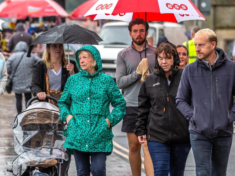 People braving the Regatta Monday downpours.
picture: Brian Murfeld