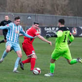 Liam Hardy, Liversedge FC, battles it out with Bridlington Town.
