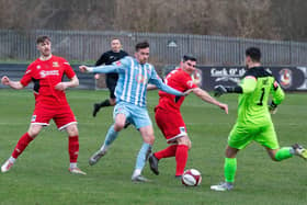 Liam Hardy, Liversedge FC, battles it out with Bridlington Town.