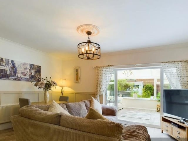 Versatile living space, with doors through to the conservatory.