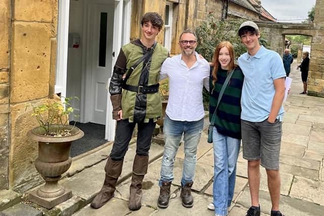 Fyling Hall students Tomas, Sophie and Toby with Head of English, Mr Thomas - all three students are celebrating top marks (9s) in both English exams.