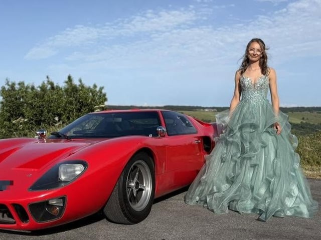 A beautiful car and a beautiful dress.