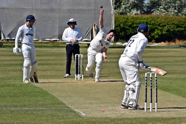 Connor Stephenson bowling for Flixton against Woodhouse Grange 2nds. Photo by Simon Dobson