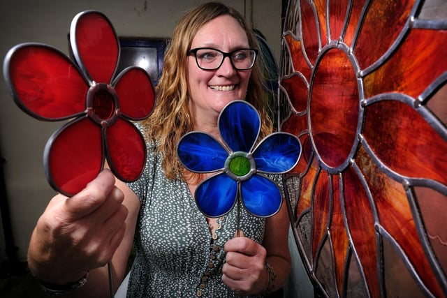 Stained glass artist Janet Fraser with some of her work.
picture: Richard Ponter