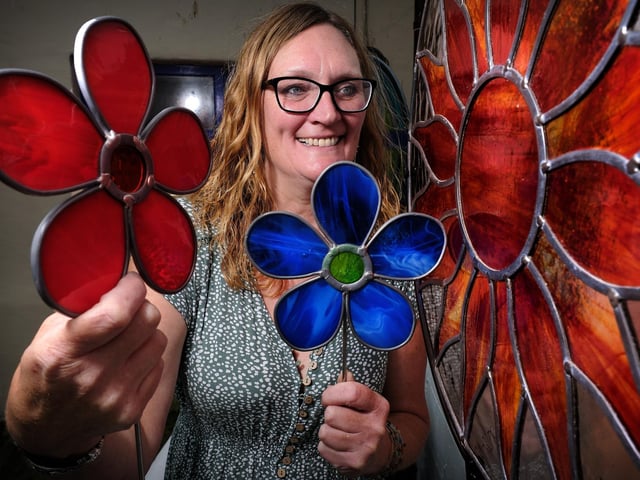 Stained glass artist Janet Fraser with some of her work.
picture: Richard Ponter
