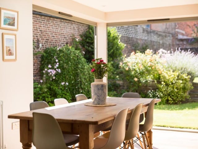 Dining space with outdoor access is ideal for entertaining.