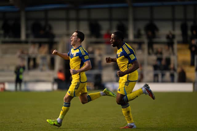 Lewis Maloney, left, celebrates his leveller with teammate Kieran Weledji. Photo by Wandering Photography