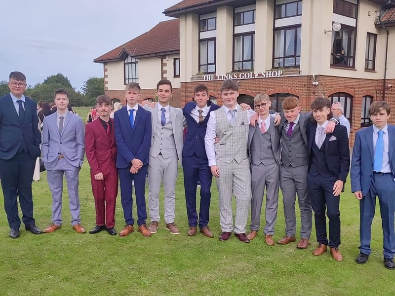 A group of mates all looking sharp in their suits!