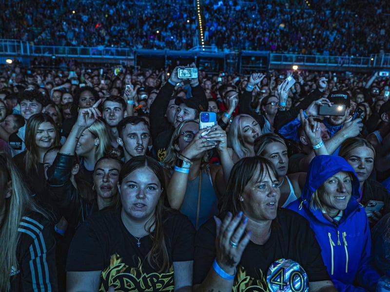 Fans capturing the moment on camera.