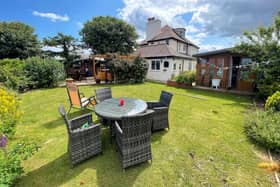 Landscaped gardens with the property include seating areas, a hot tub and two summerhouses.