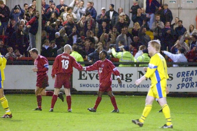 Do you know the Scarborough FC players, either side of Wayne Gill, celebrating a goal against Hereford in 2004?