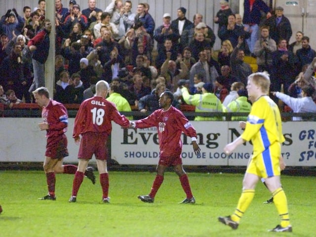 Do you know the Scarborough FC players, either side of Wayne Gill, celebrating a goal against Hereford in 2004?
