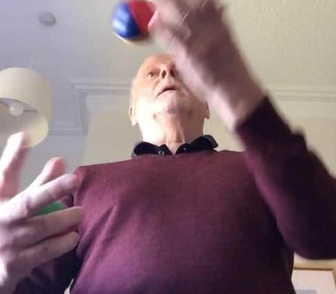 Dr Keith Souter juggling.
