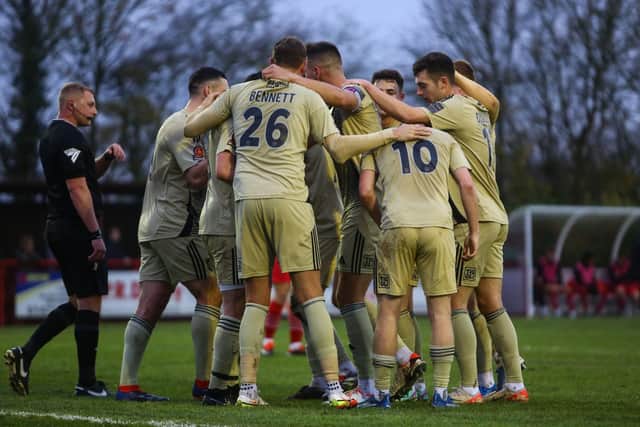 Boro celebrate the own goal that put them ahead in their 1-1 draw at Needham Market. Photo by Zach Forster