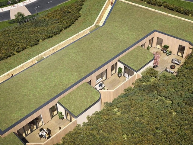 Looking over the private courtyards and terraces offered with the glass-front villas.