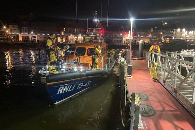 Whitby lifeboat crew in the harbour