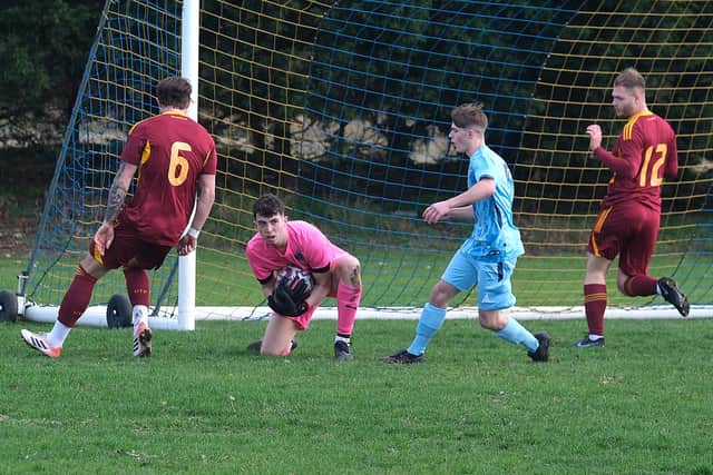 The visiting keeper gathers the ball before Seamer can get to it. Photo by Richard Ponter