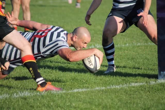 Pocklington RUFC skipper Joe Holbrough stretches out to score Pocklington's third try on Saturday. PHOTO BY PHIL GILBANK