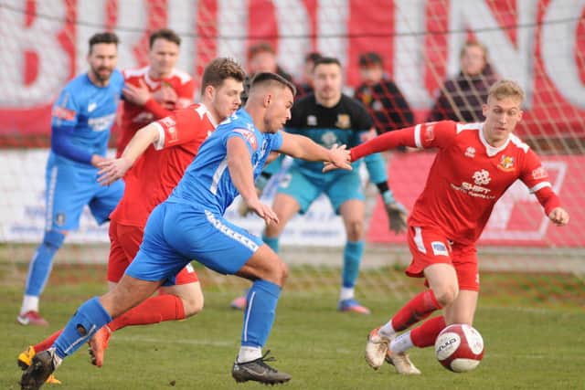 Bridlington Town's Benn Lewis and Will Sutton defending against Dunston's Liam Thear. PHOTOS BY DOM TATLOR