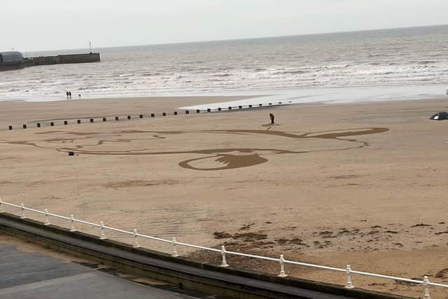 Ian Sandy took this photo of the recent large beach art installation.