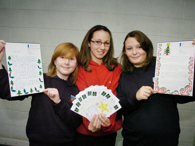 Pindar School students Rowan Manship (left) and Tiffany Draper (right) won letter writing competitions pictured with designer Beth Vickers. 084679