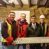 Adam Ramsden, safety adviser, David John, director of sites, Prime Minister Rishi Sunak, Penny Holland, project manager, Shuja Khan, chief executive at Arqiva, Billy Wilkinson, rigger with a piece of steel signed by Mr Sunak to be used in the mast construction.