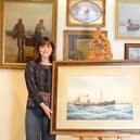Holly Hammond of David Duggleby with the watercolour painting of the Ellesmere.