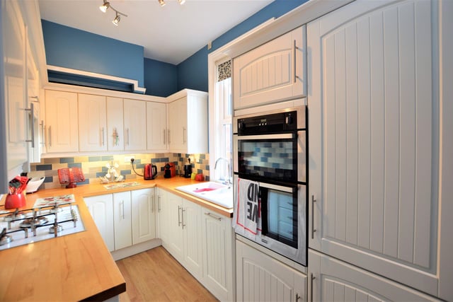 The kitchen has an extensive range of units.