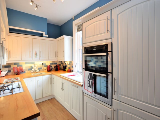 The kitchen has an extensive range of units.
