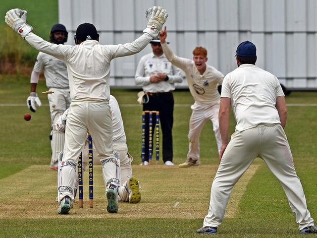 Clarke Duughney dismisses Luke Smith bowled around his pads