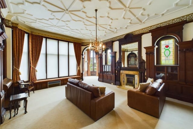 A lovely reception room with feature fireplace.