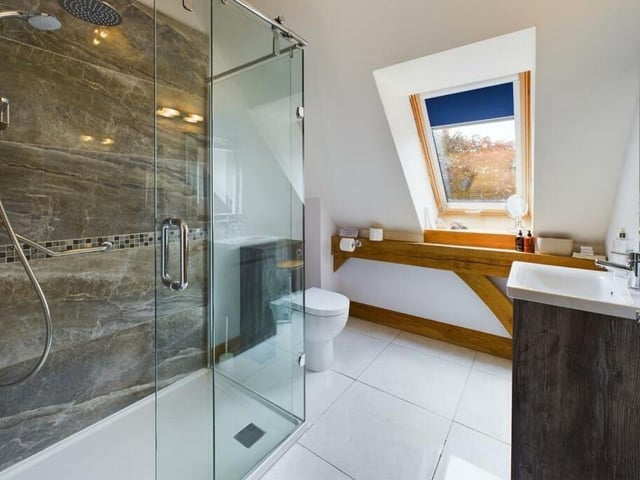 One of three sleek and stylish bathrooms.